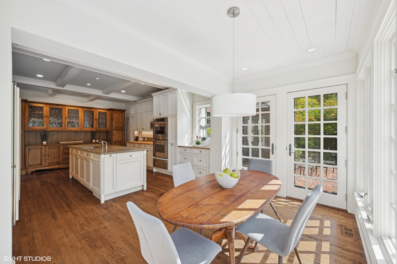 36 Indian Hill Road Winnetka, IL 60093 - Photo 12 of 51 a open kitchen with white cabinets and stainless steel appliances