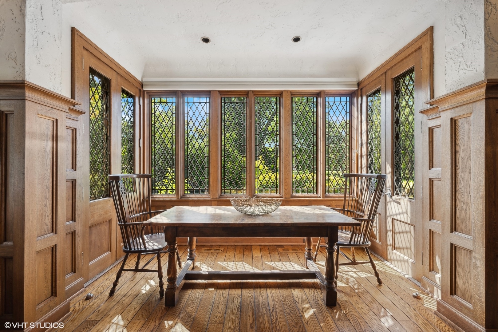36 Indian Hill Road Winnetka, IL 60093 - Photo 16 of 51 a view of a dining room with furniture window and wooden floor