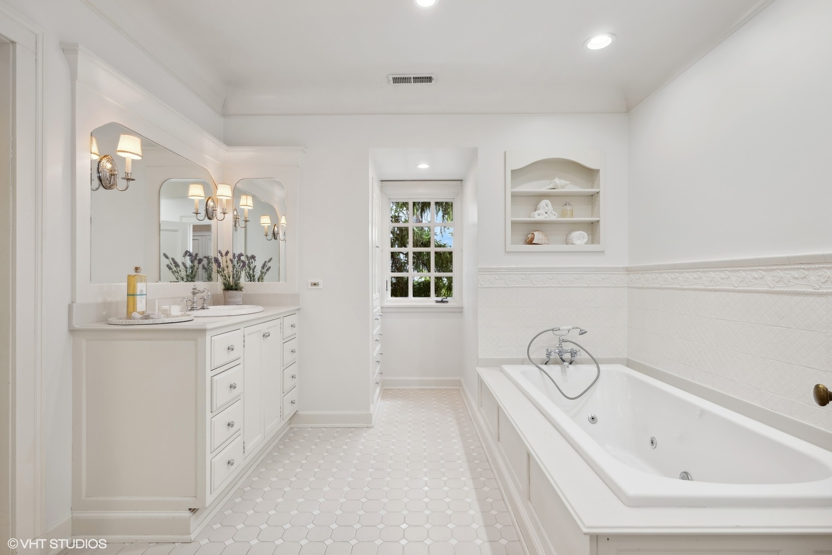 36 Indian Hill Road Winnetka, IL 60093 - Photo 27 of 51 a bathroom with a bathtub sink and mirror