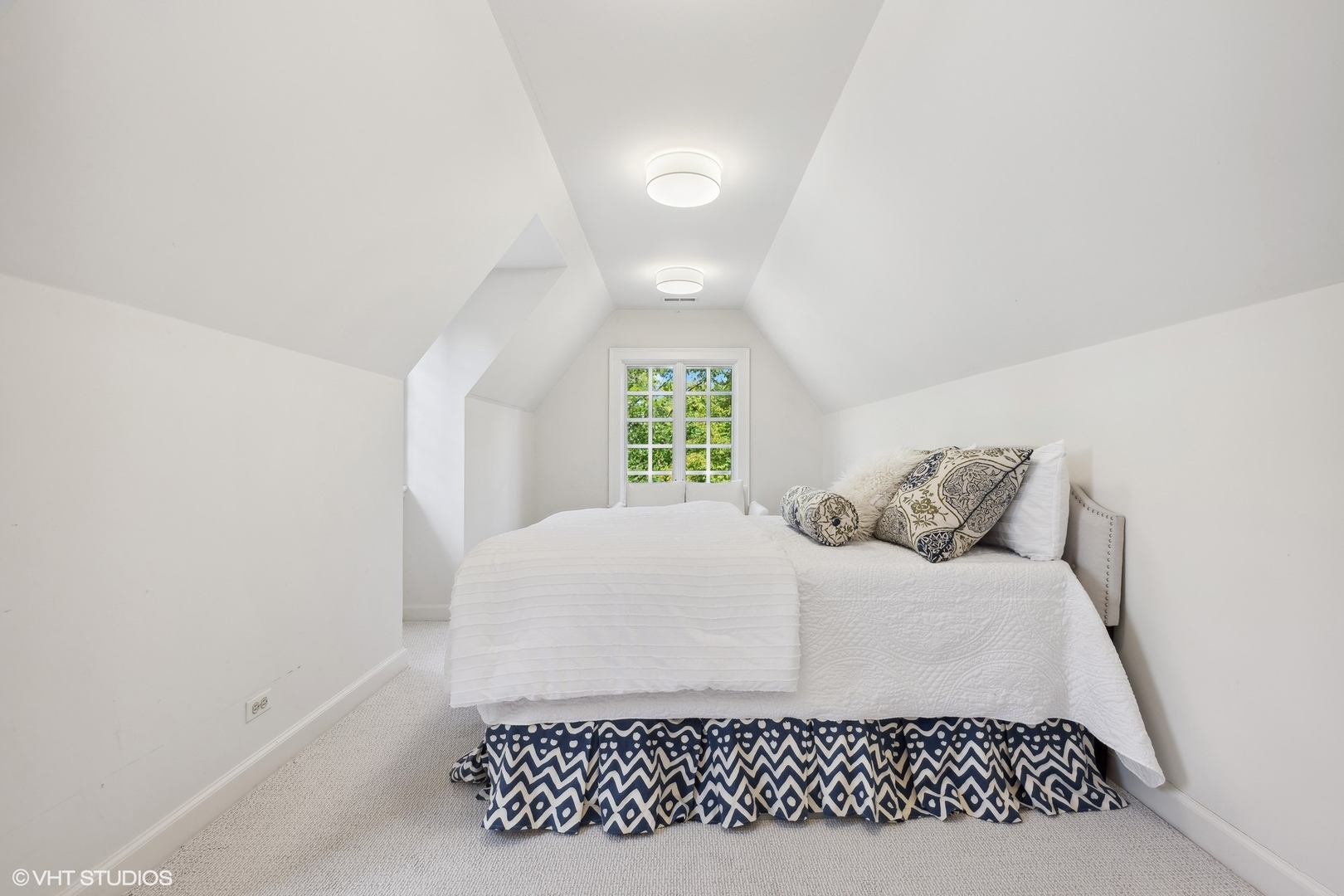 36 Indian Hill Road Winnetka, IL 60093 - Photo 29 of 51 a bedroom with a white bed and a window