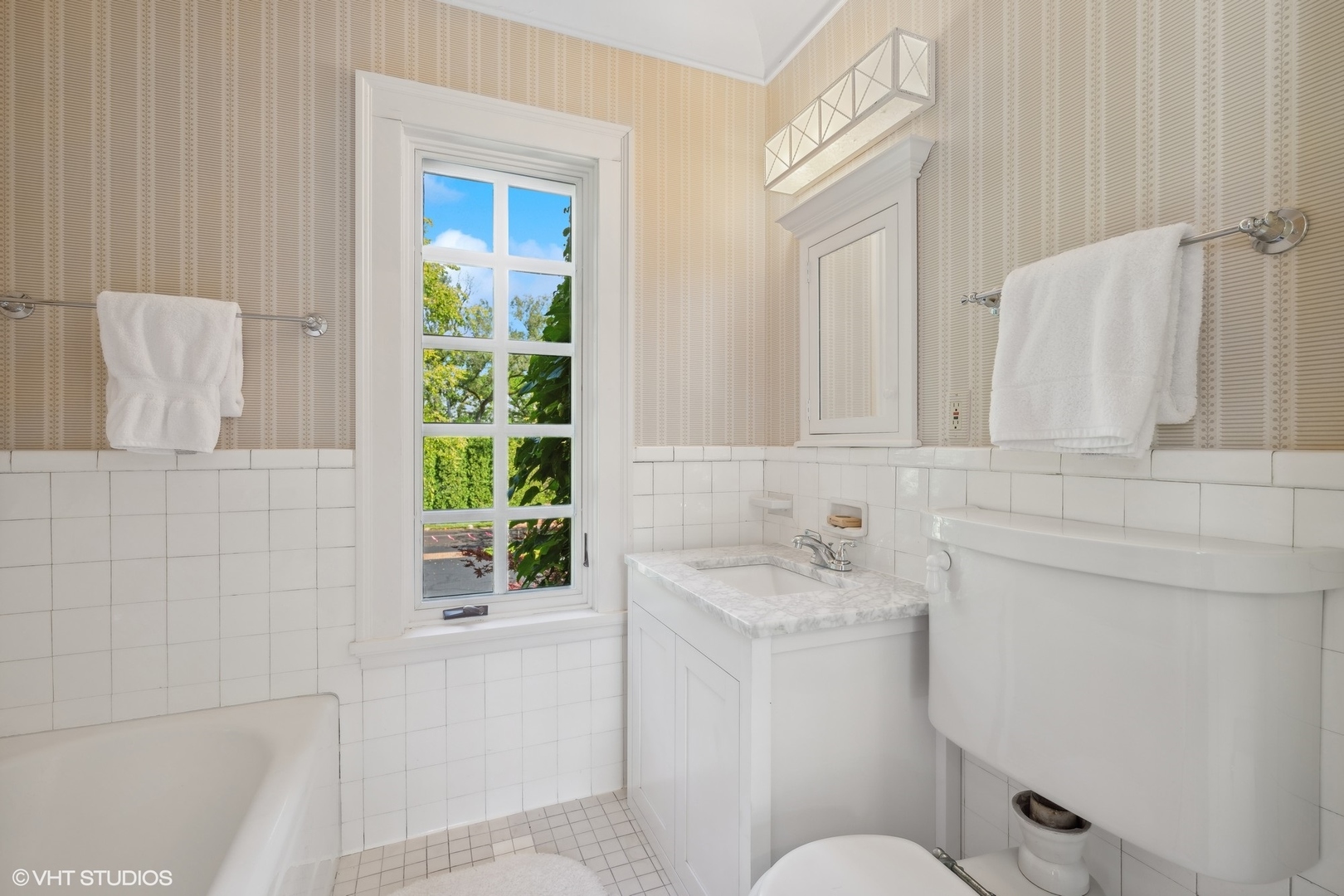36 Indian Hill Road Winnetka, IL 60093 - Photo 35 of 51 a bathroom with a sink and a toilet