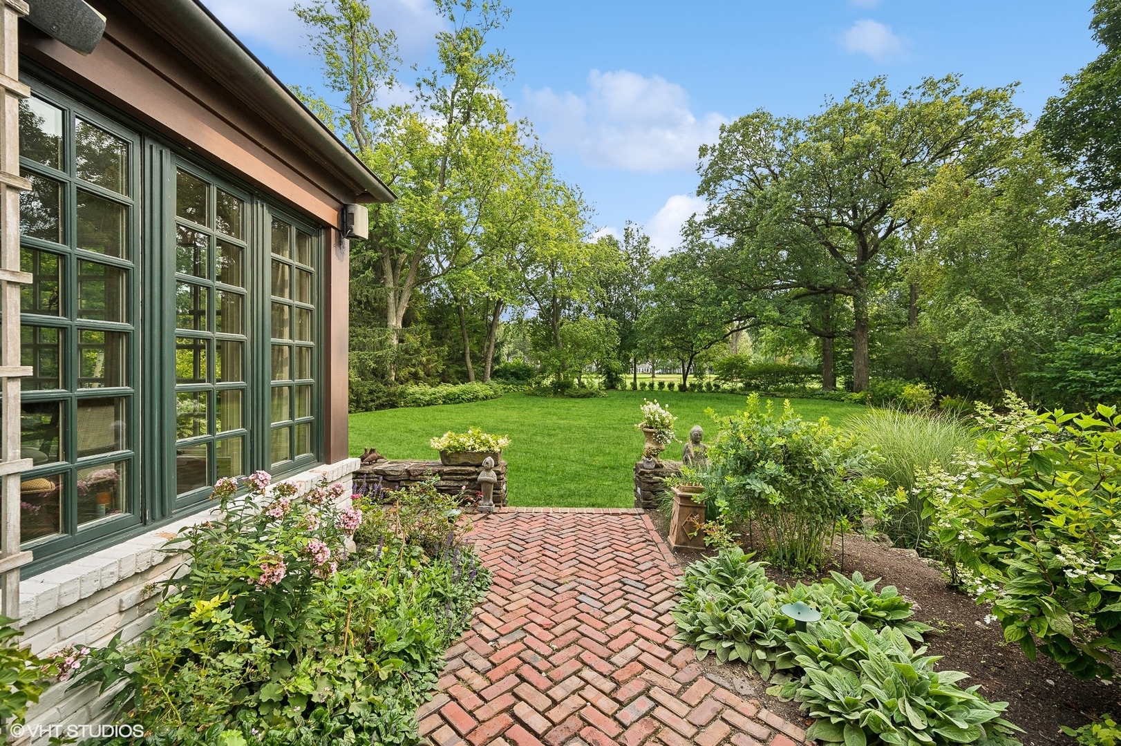 36 Indian Hill Road Winnetka, IL 60093 - Photo 43 of 51 a view of a garden with a pathway