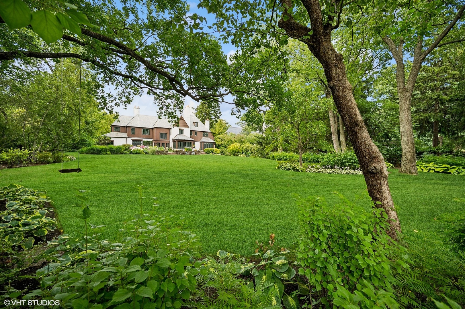 36 Indian Hill Road Winnetka, IL 60093 - Photo 48 of 51 a front view of a house with a yard