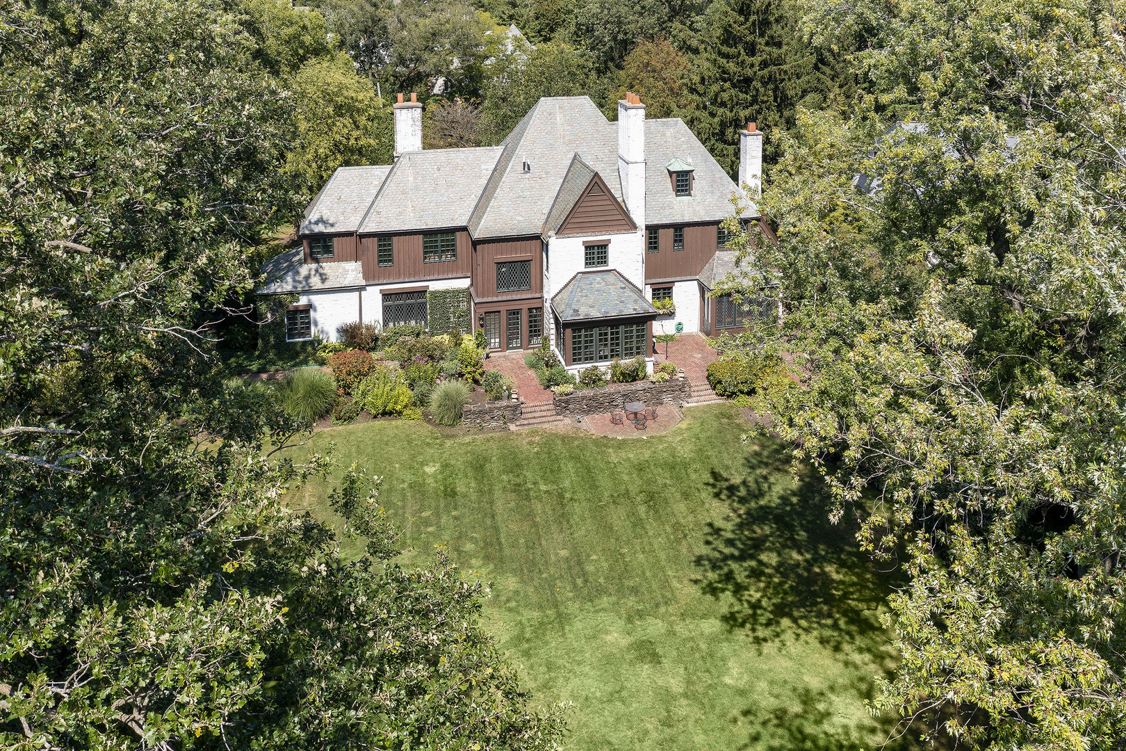 36 Indian Hill Road Winnetka, IL 60093 - Photo 49 of 51 an aerial view of a house with garden space and trees all around