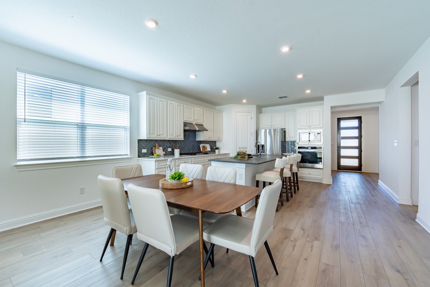 1040 Villa Rialto View Leander, TX 78641 - Photo 11 of 27 Dining area featuring light wood-type flooring, plenty of natural light, and recessed lighting