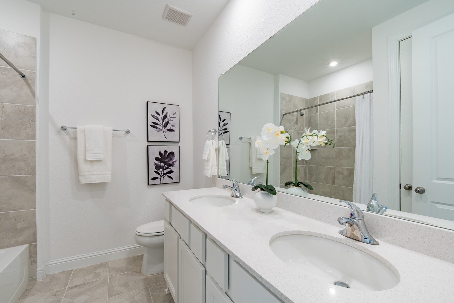 1040 Villa Rialto View Leander, TX 78641 - Photo 22 of 27 Bathroom featuring double vanity and shower / bath combo with shower curtain