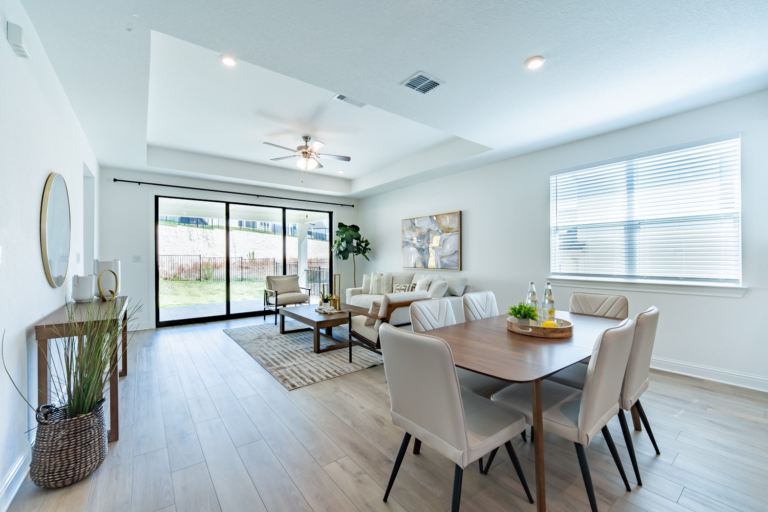 1040 Villa Rialto View Leander, TX 78641 - Photo 5 of 27 Dining area featuring ceiling fan, a raised ceiling, and light wood finished floors