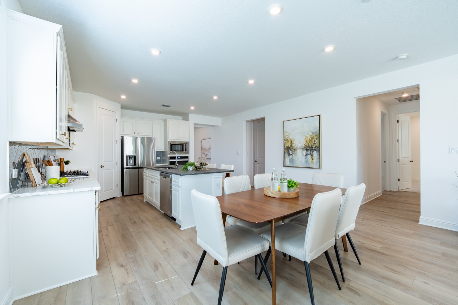 1040 Villa Rialto View Leander, TX 78641 - Photo 8 of 27 Dining area featuring light wood-style floors and recessed lighting