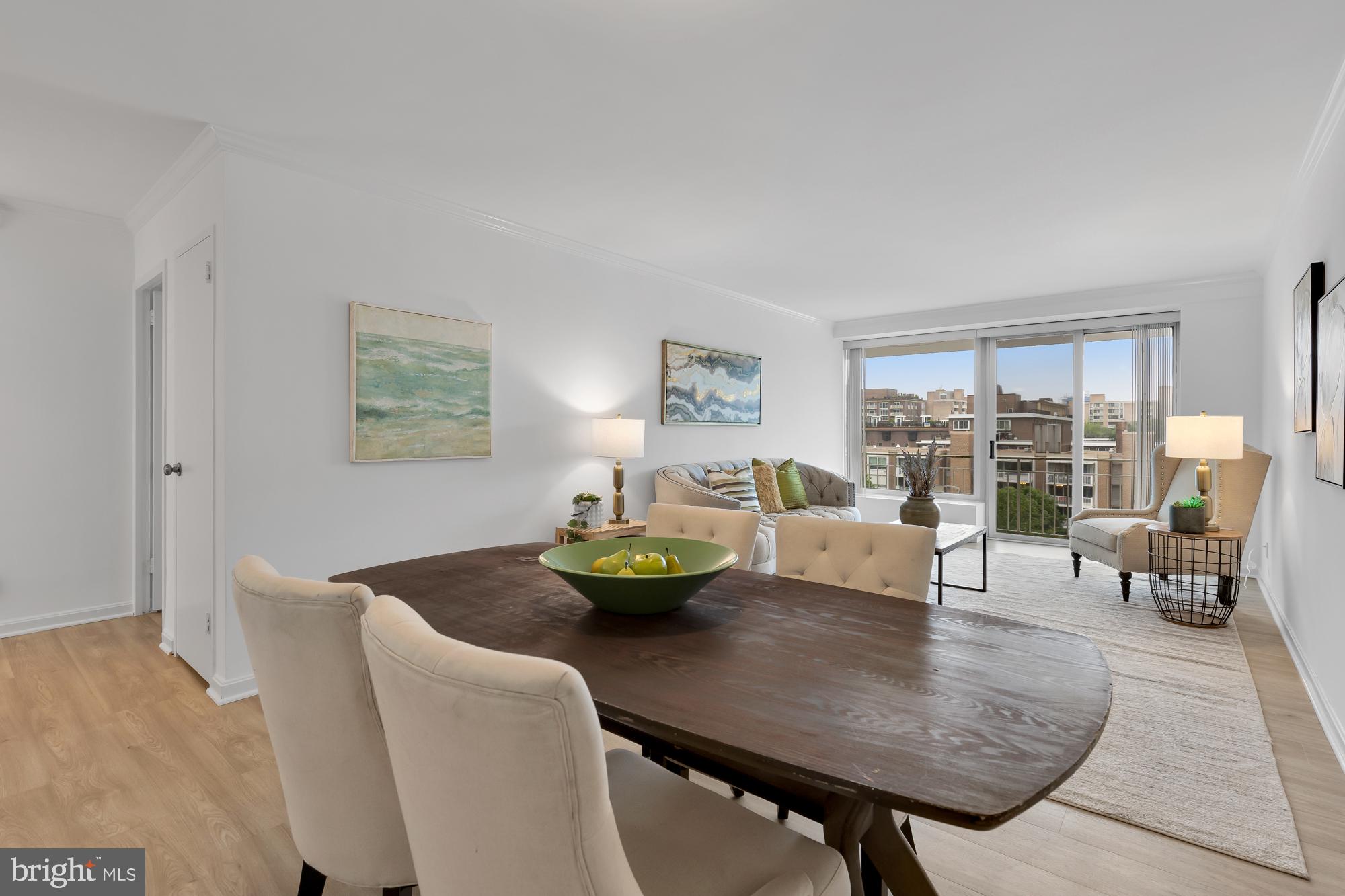 a view of a dining room with furniture and a table