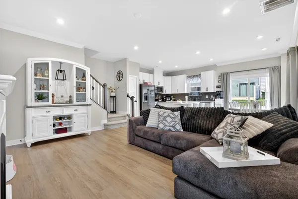 a living room with furniture fireplace and flat screen tv