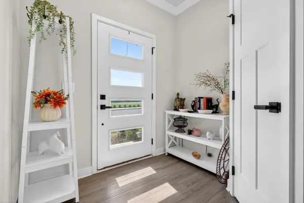 a view of a hallway with a wooden floor