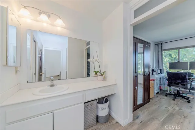 a bathroom with a sink double vanity and a mirror