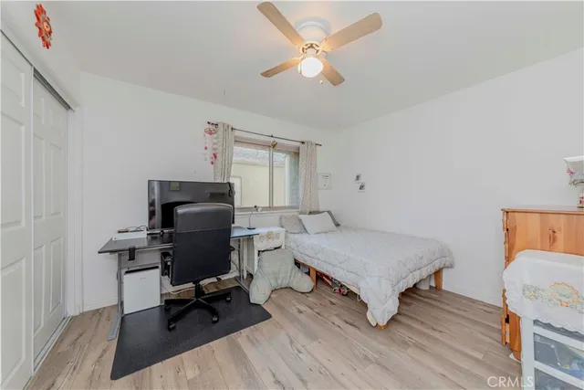 a view of a workspace with furniture and a bedroom