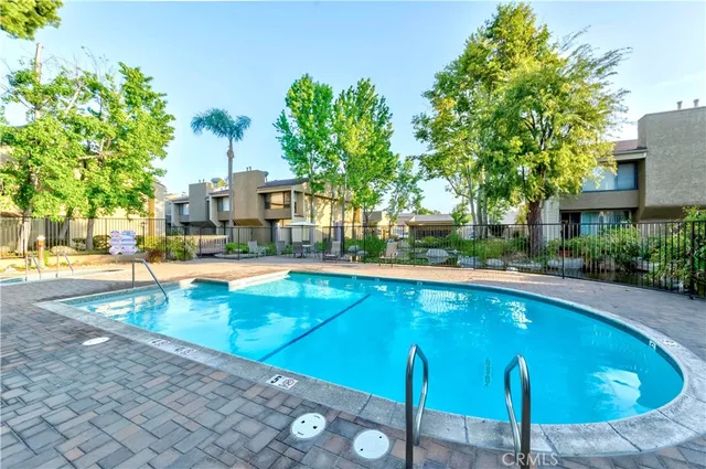 a view of a swimming pool with a patio