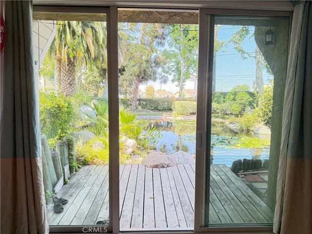 a view of a room and wooden floor
