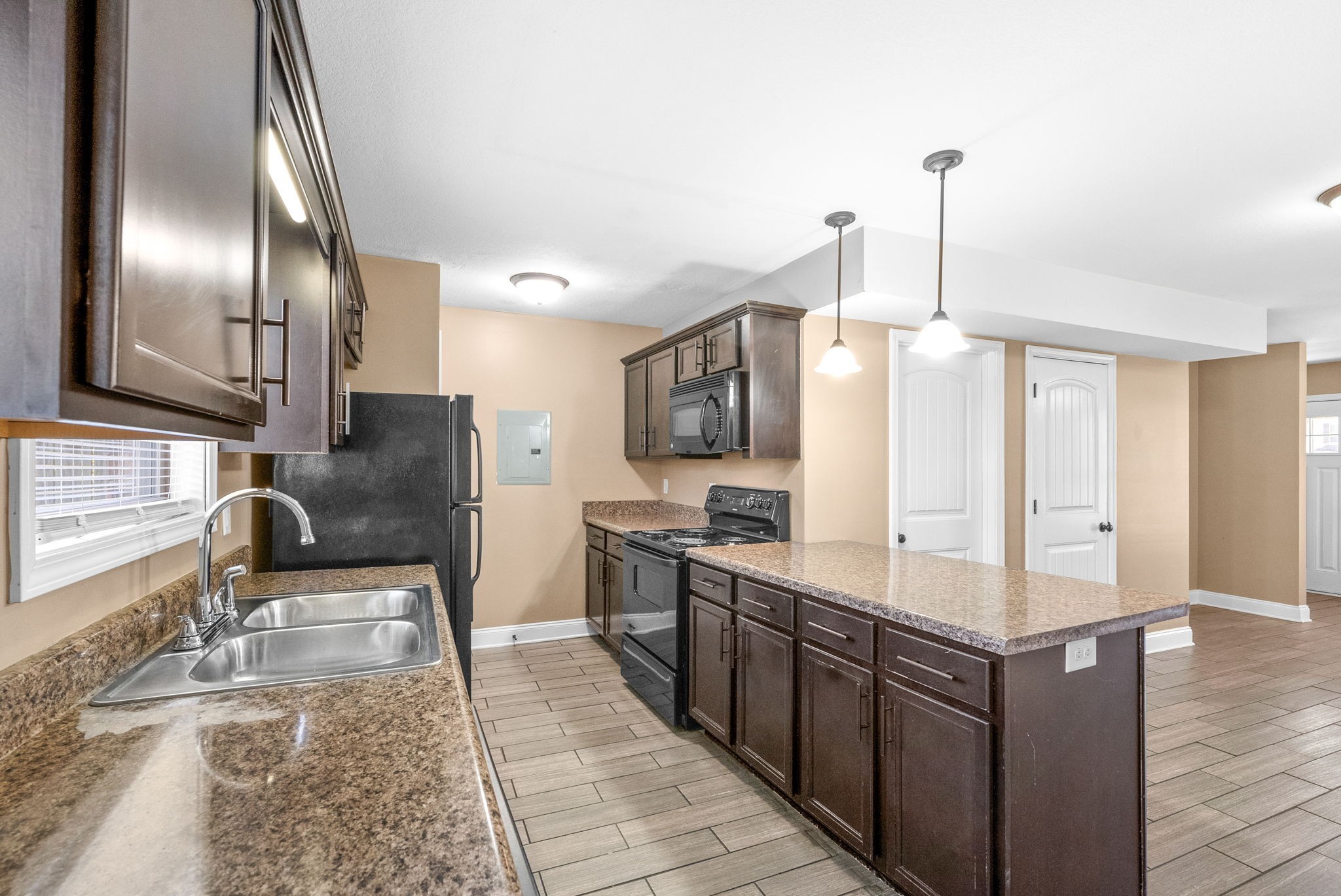 1769 Spring Water Drive, Unit C Clarksville, TN 37040 - Photo 11 of 25 a kitchen with stainless steel appliances granite countertop a sink stove and refrigerator