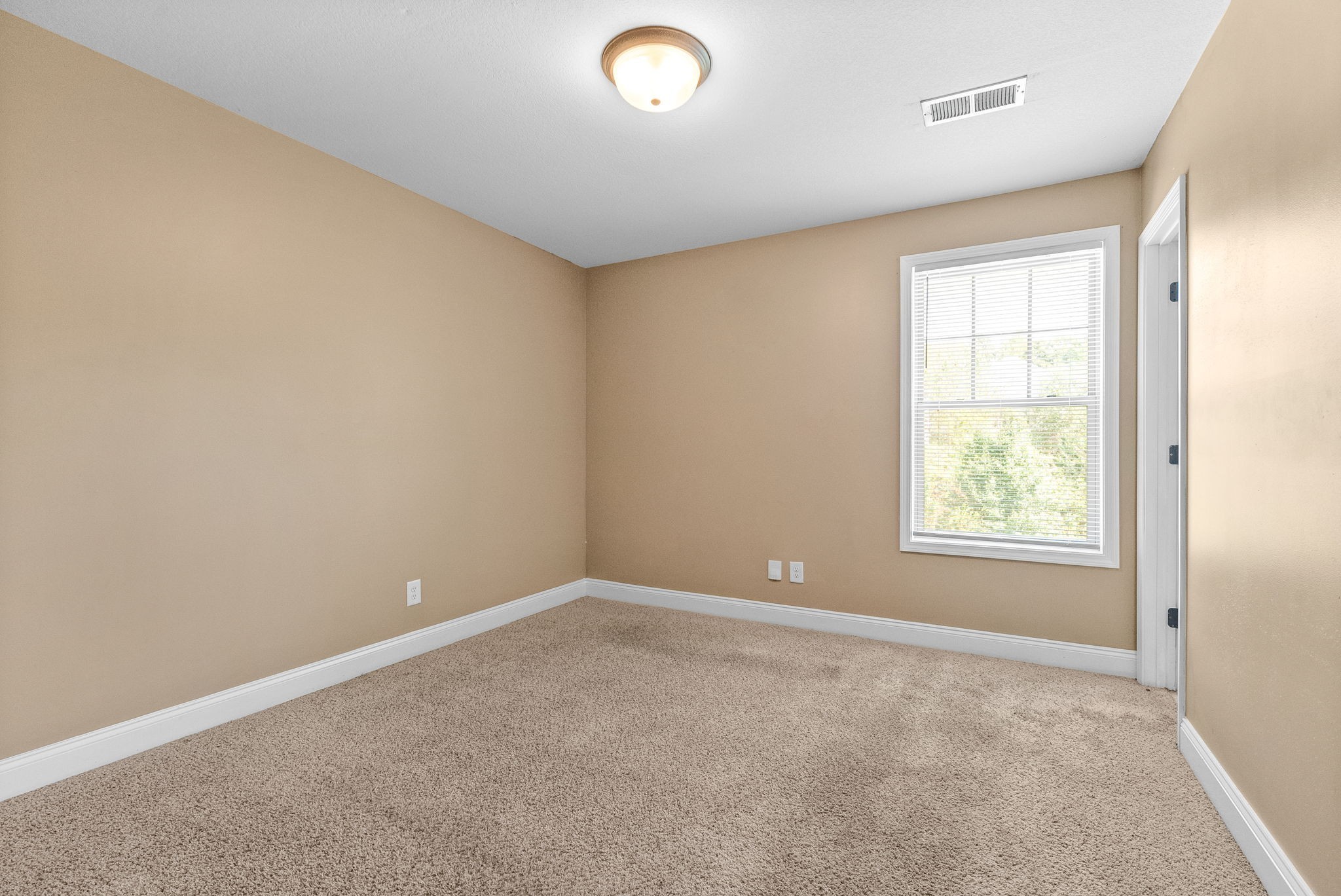 1769 Spring Water Drive, Unit C Clarksville, TN 37040 - Photo 14 of 25 a view of an empty room with a window