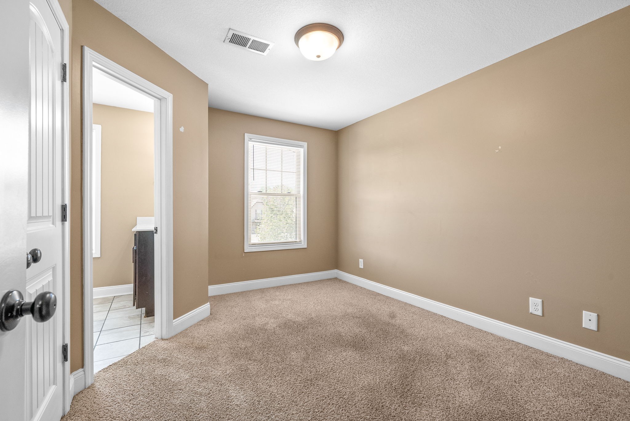 1769 Spring Water Drive, Unit C Clarksville, TN 37040 - Photo 19 of 25 an empty room with windows and view of kitchen