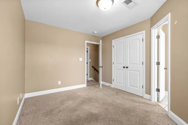 a bathroom with a toilet sink and a window