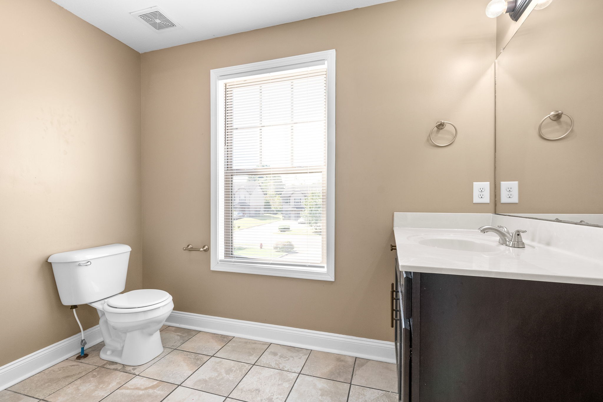 1769 Spring Water Drive, Unit C Clarksville, TN 37040 - Photo 21 of 25 a bathroom with a toilet sink and a window