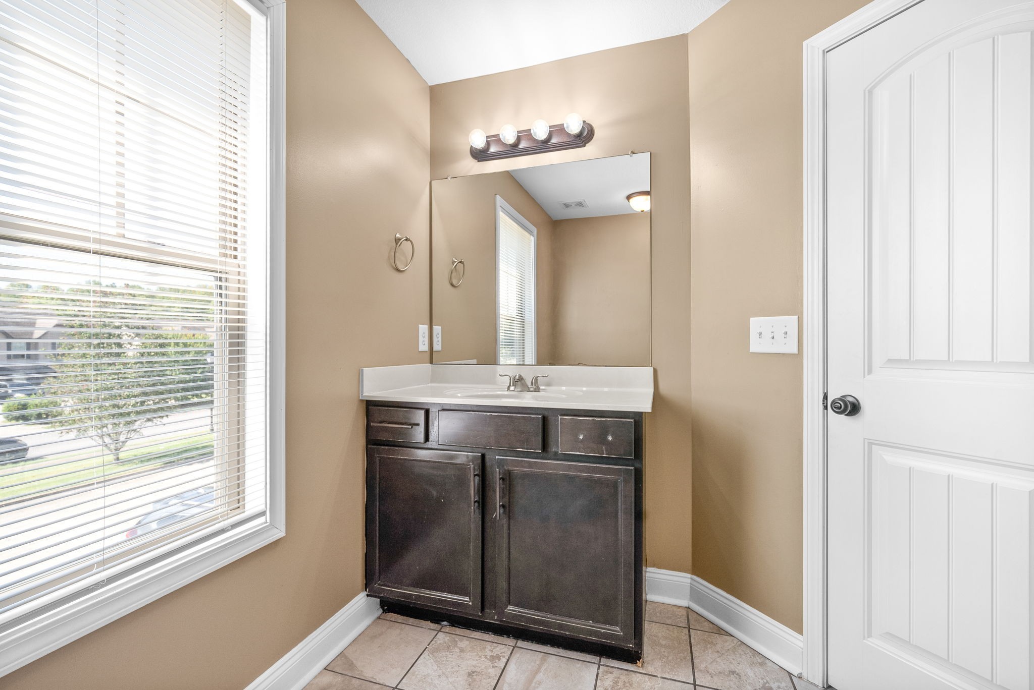 1769 Spring Water Drive, Unit C Clarksville, TN 37040 - Photo 23 of 25 a bathroom with a sink and a mirror