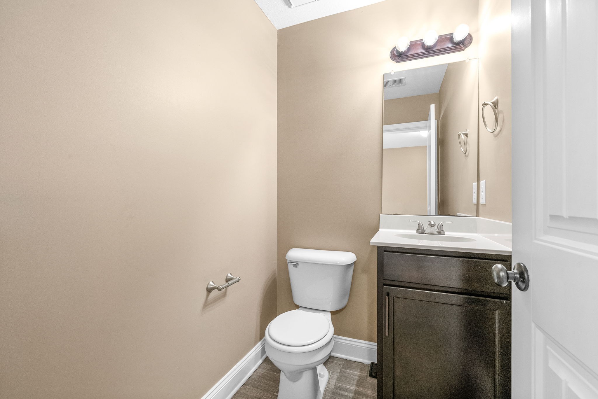 1769 Spring Water Drive, Unit C Clarksville, TN 37040 - Photo 8 of 25 a bathroom with a toilet sink and mirror