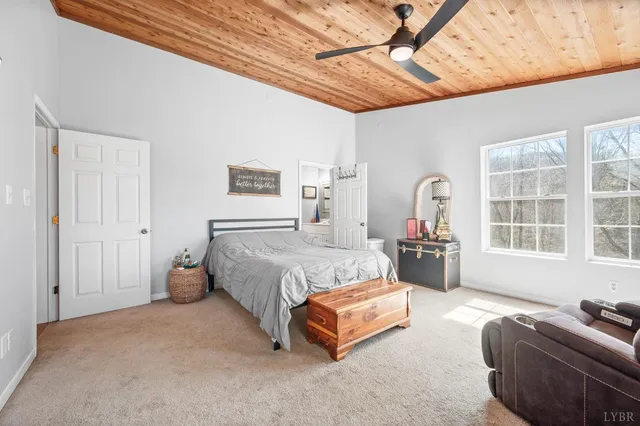 an aerial view of a house with a yard swimming pool and outdoor seating