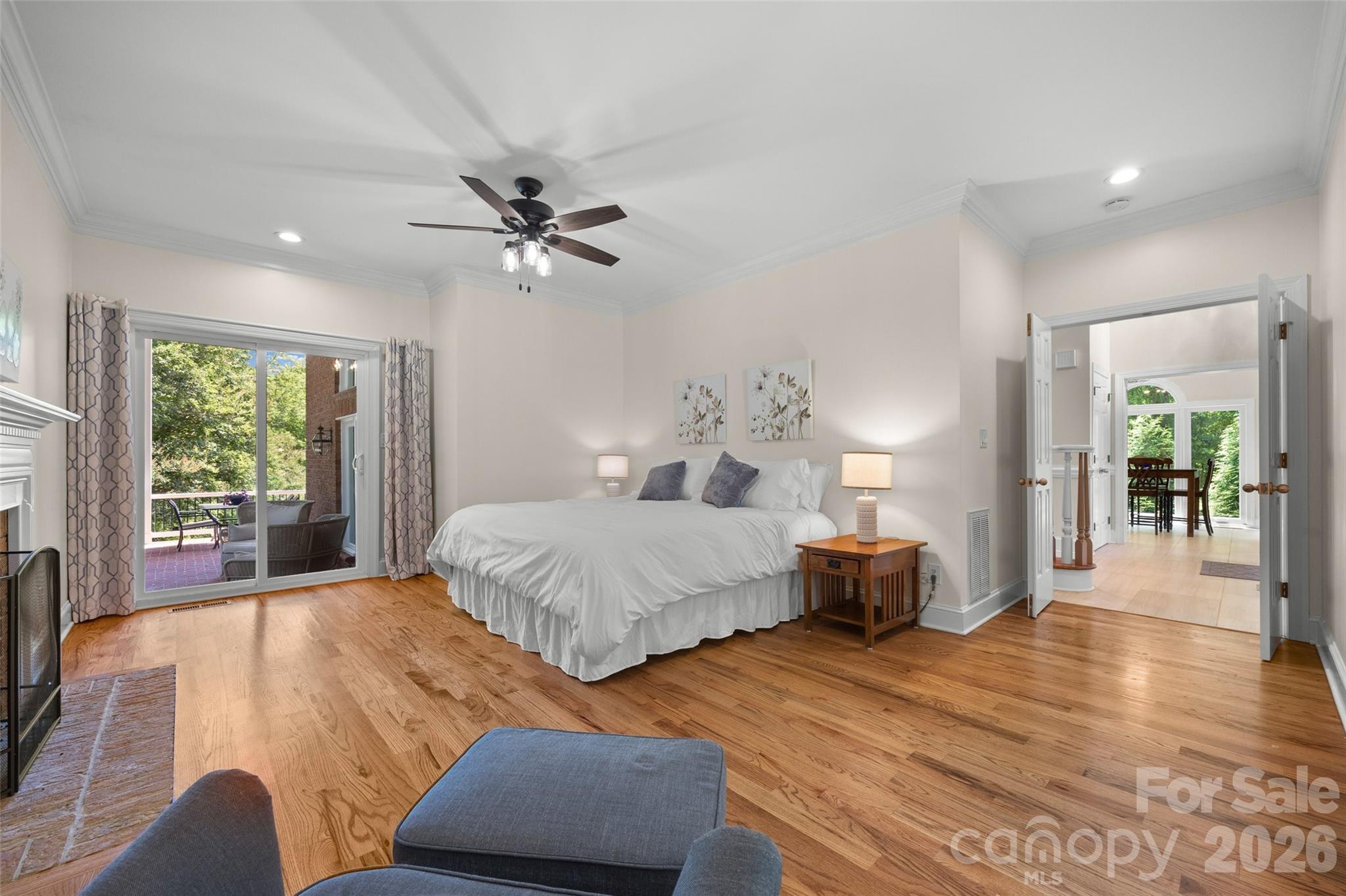 636 Landsdowne Court Fort Mill, SC 29708 - Photo 18 of 48 a spacious bedroom with a bed a dresser and wooden floor
