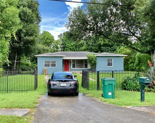 a car parked in front of a house