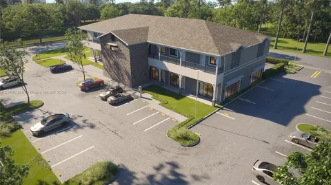 a view of a house with pool and chairs