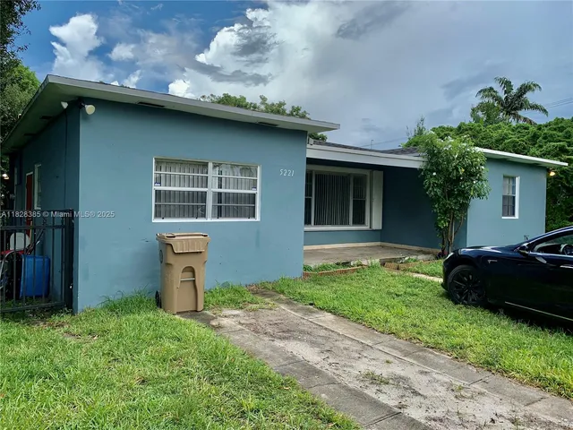 a house view with a garden space
