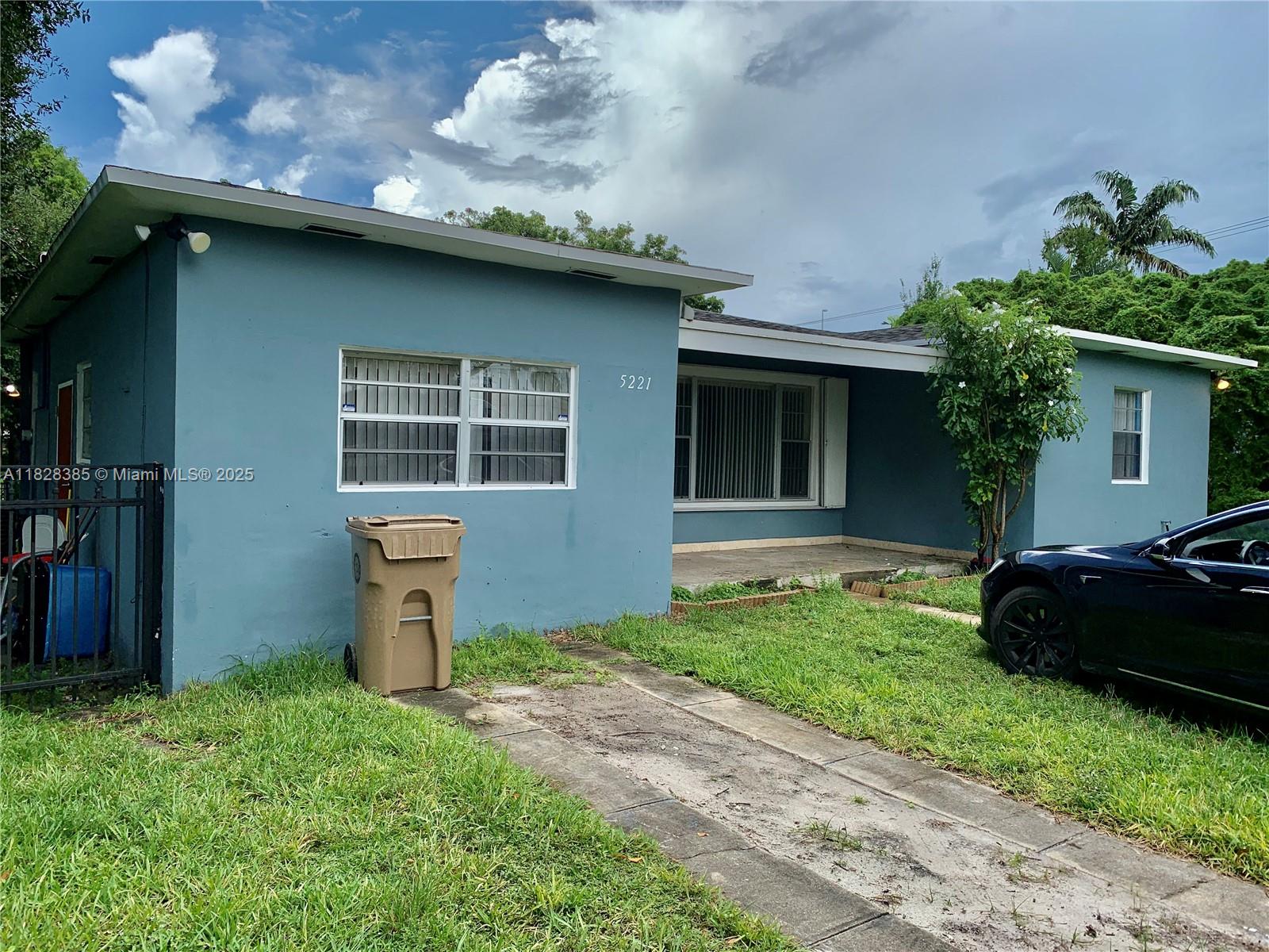 5221 Orange Drive Davie, FL 33314 - Photo 3 of 19 a house view with a garden space