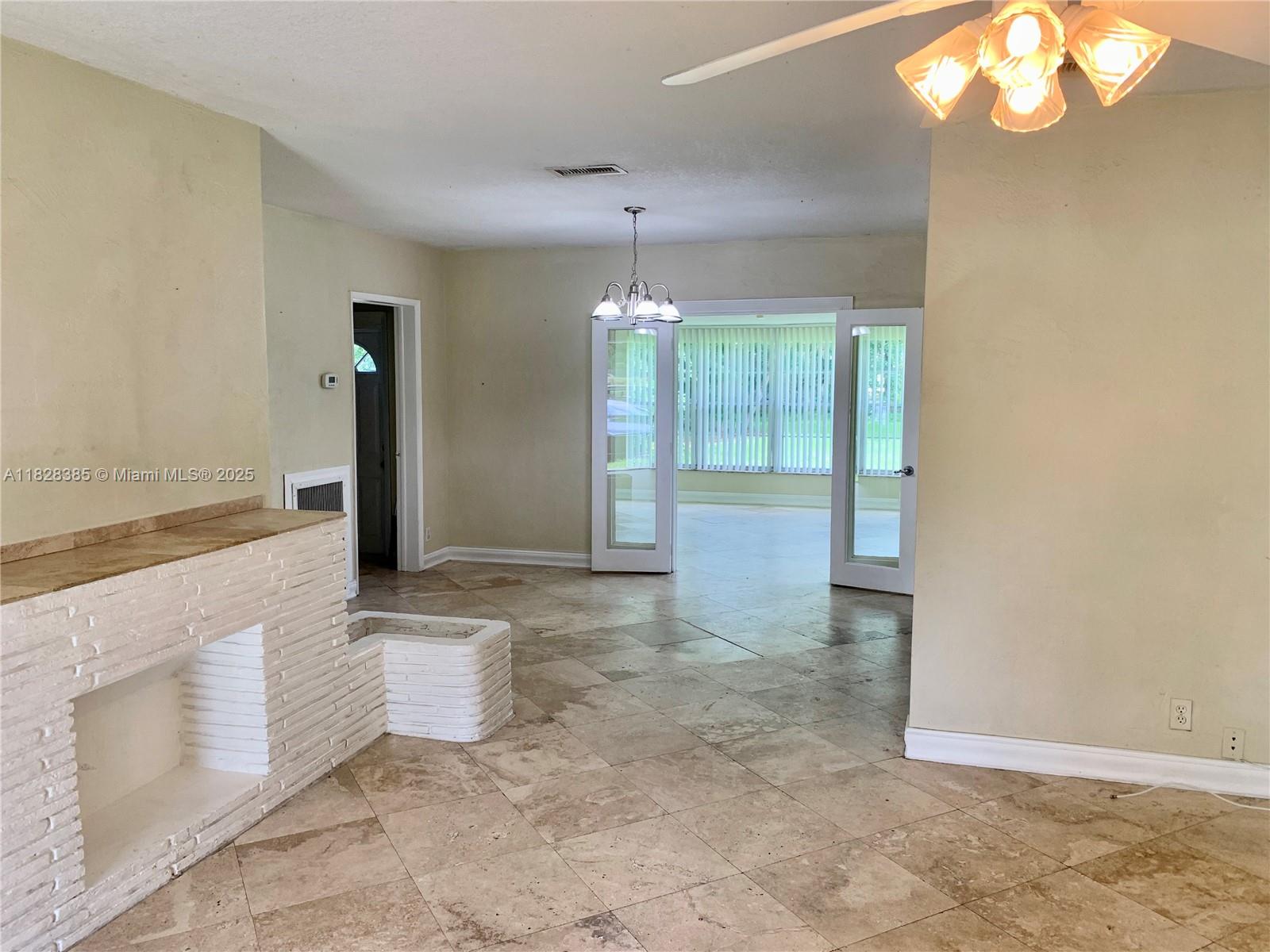 5221 Orange Drive Davie, FL 33314 - Photo 4 of 19 a view of a room with a chandelier