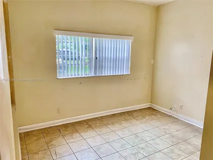 a view of a room that has a window in it