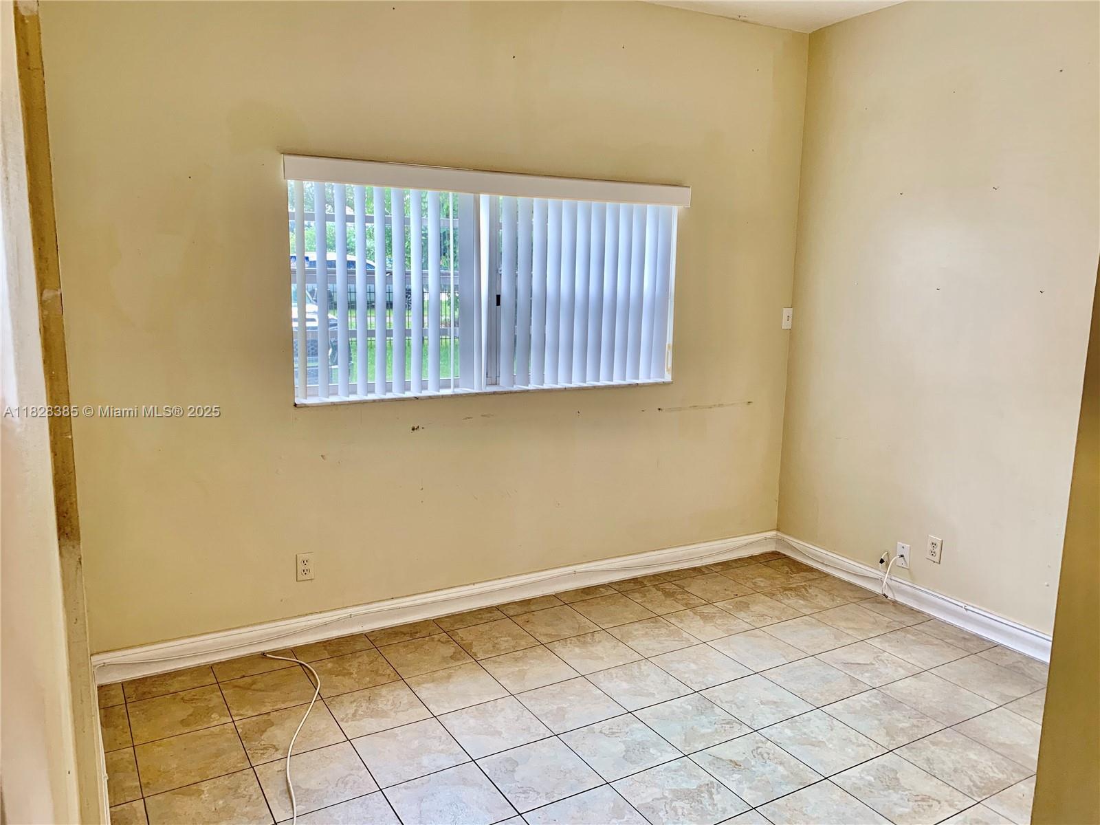 5221 Orange Drive Davie, FL 33314 - Photo 10 of 19 a view of a room that has a window in it