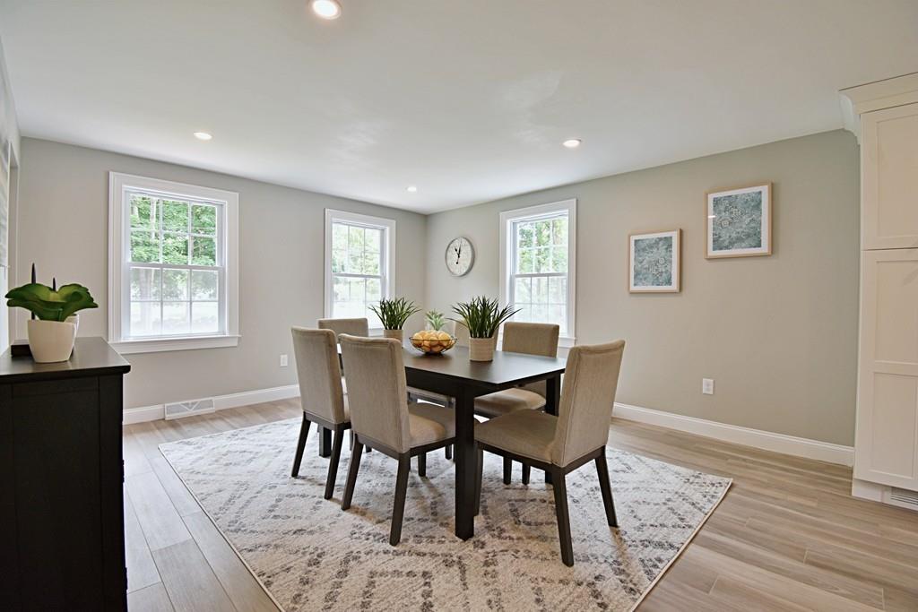 65 Spaulding Road Chelmsford, MA 01824 - Photo 12 of 42 a view of a dining room with furniture window and wooden floor