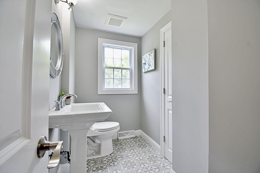 65 Spaulding Road Chelmsford, MA 01824 - Photo 23 of 42 a bathroom with a sink toilet and a mirror