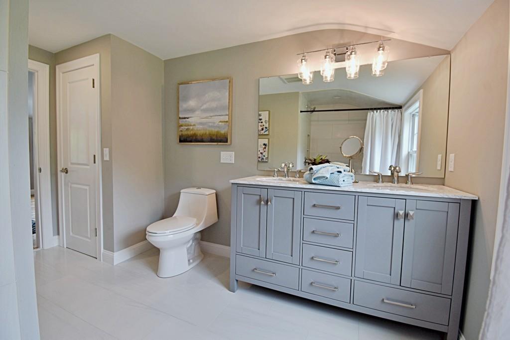 65 Spaulding Road Chelmsford, MA 01824 - Photo 28 of 42 a bathroom with a toilet sink and mirror