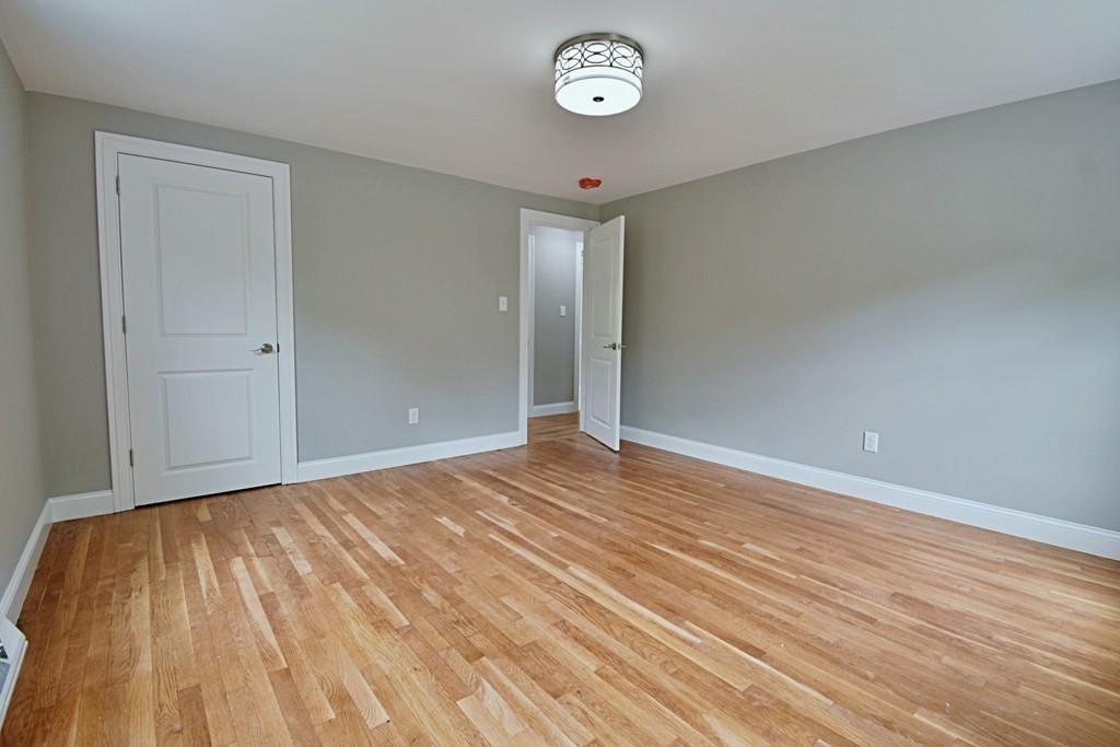 65 Spaulding Road Chelmsford, MA 01824 - Photo 32 of 42 a view of empty room with wooden floor