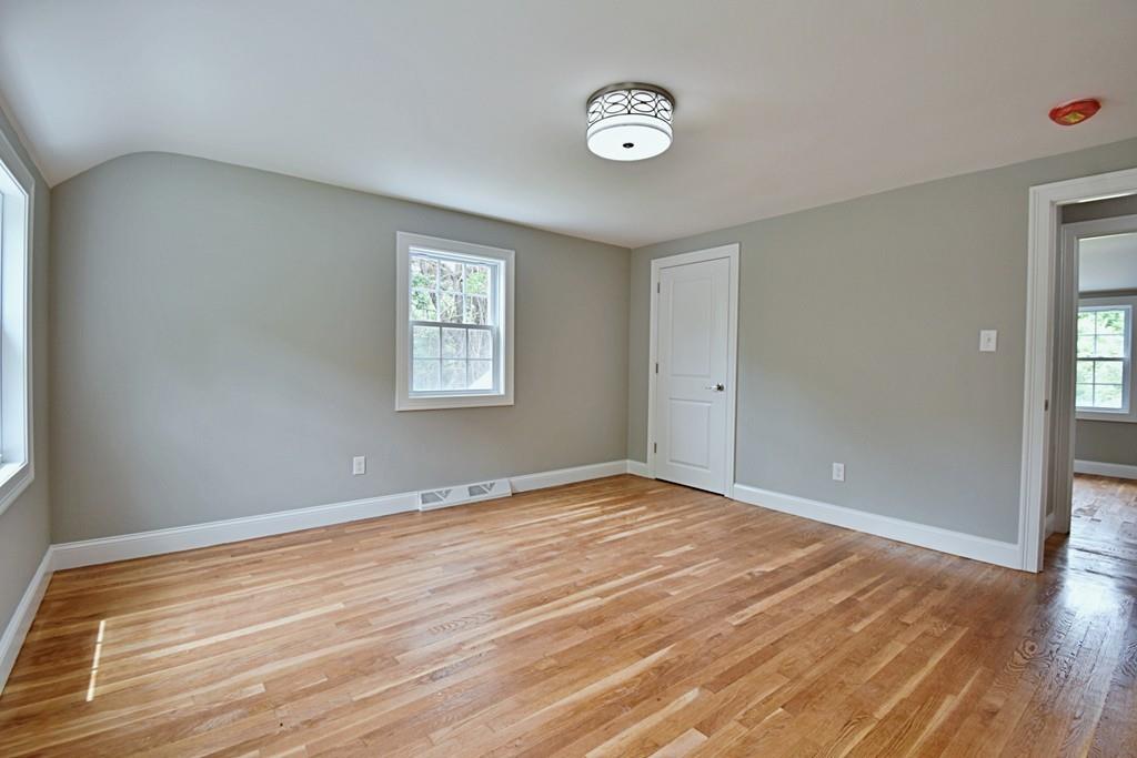 65 Spaulding Road Chelmsford, MA 01824 - Photo 33 of 42 a view of an empty room with wooden floor and a window