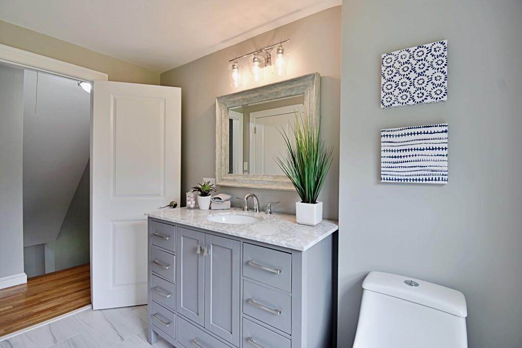 65 Spaulding Road Chelmsford, MA 01824 - Photo 38 of 42 a bathroom with a sink a toilet and mirror