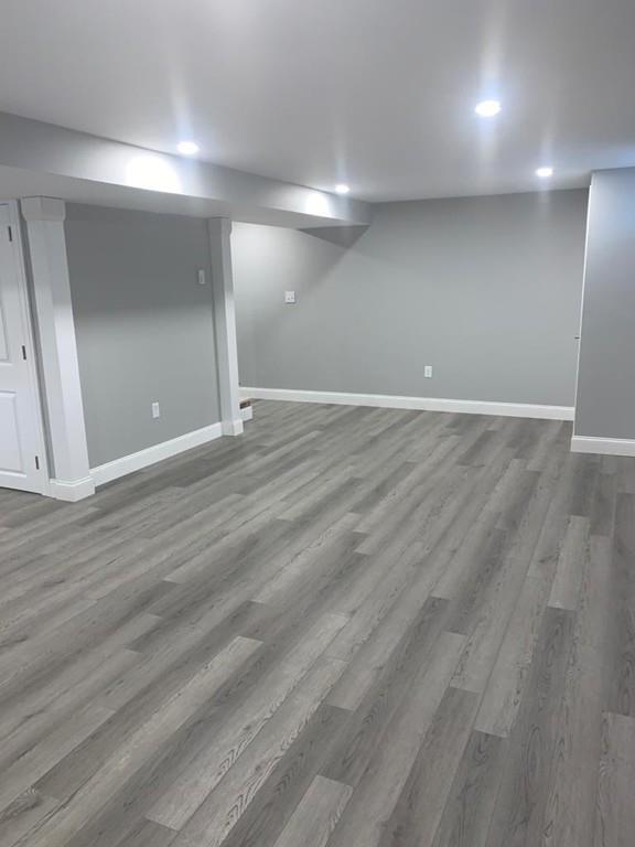 65 Spaulding Road Chelmsford, MA 01824 - Photo 40 of 42 an empty room with wooden floor and windows