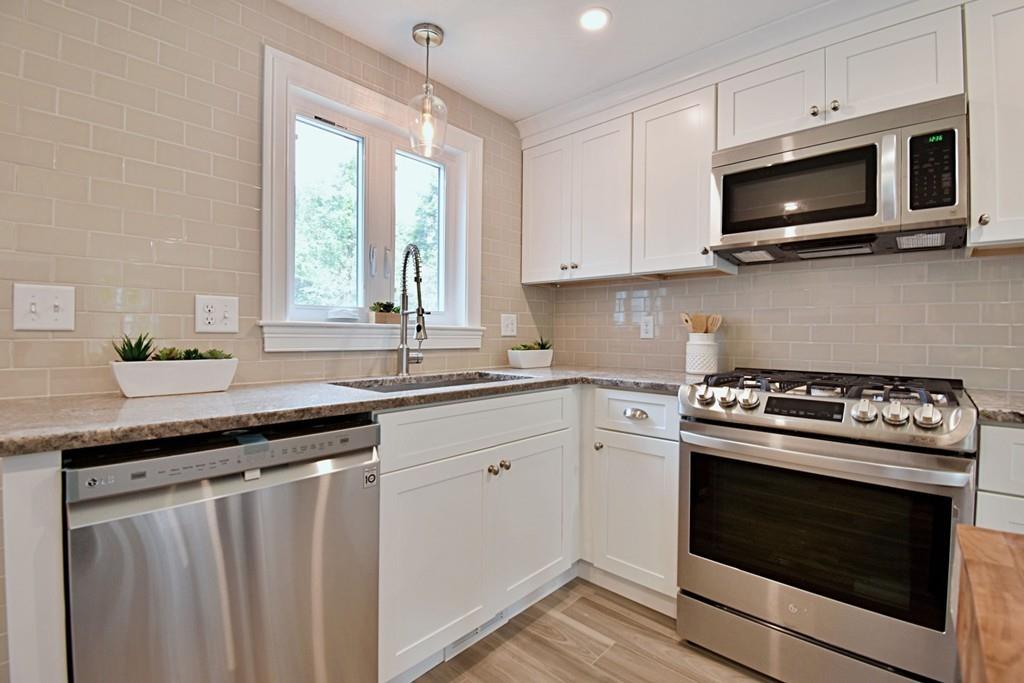 65 Spaulding Road Chelmsford, MA 01824 - Photo 9 of 42 a kitchen with a stove and a sink