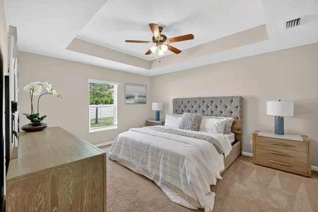 a bedroom with a bed and window