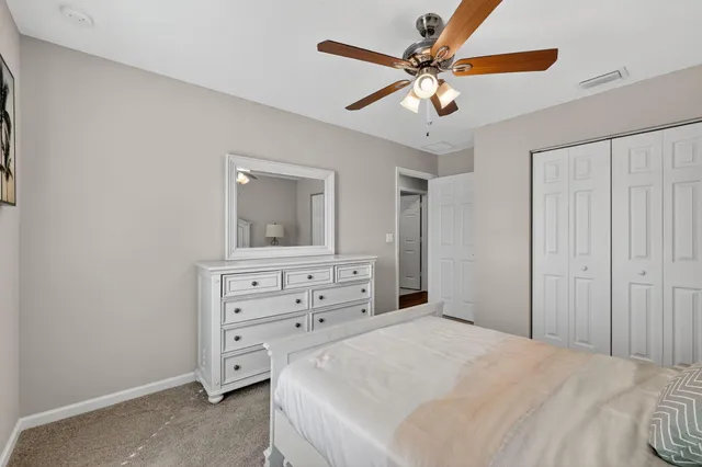 a bedroom with a baby bed and a dresser