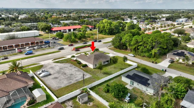an aerial view of a house with a garden