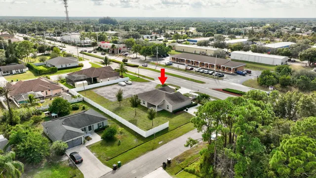 a view of swimming pool with outdoor seating and plants