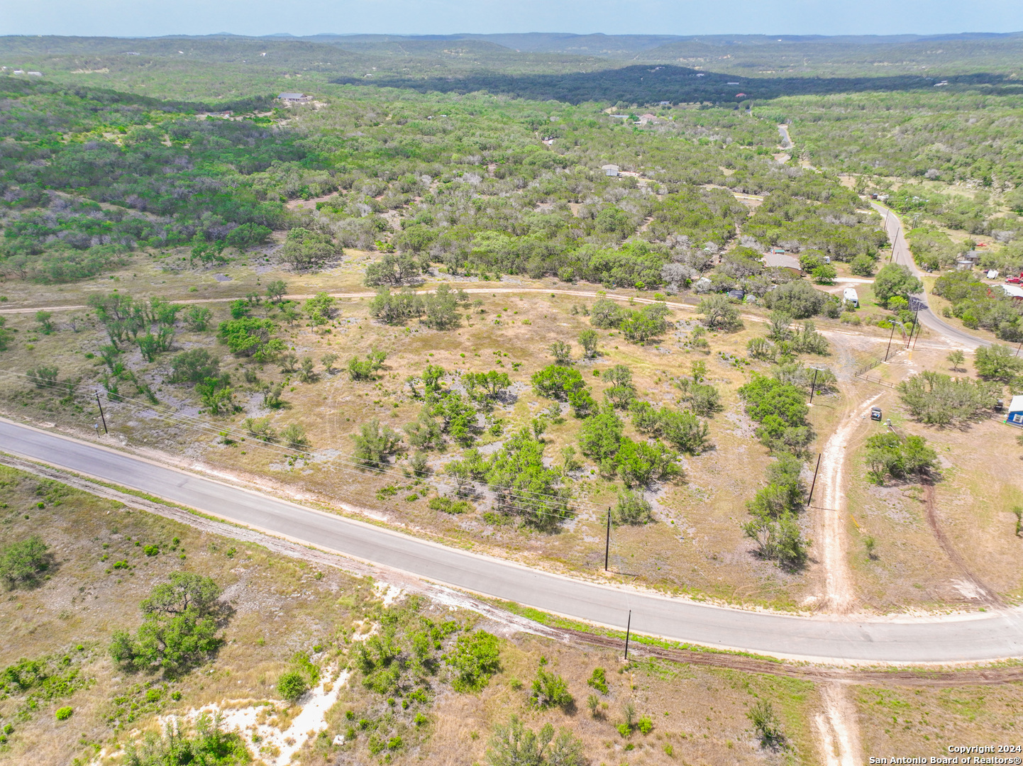 264 Grand Ranch Hondo, TX 78861 - Photo 3 of 16 a view of a lake from a yard