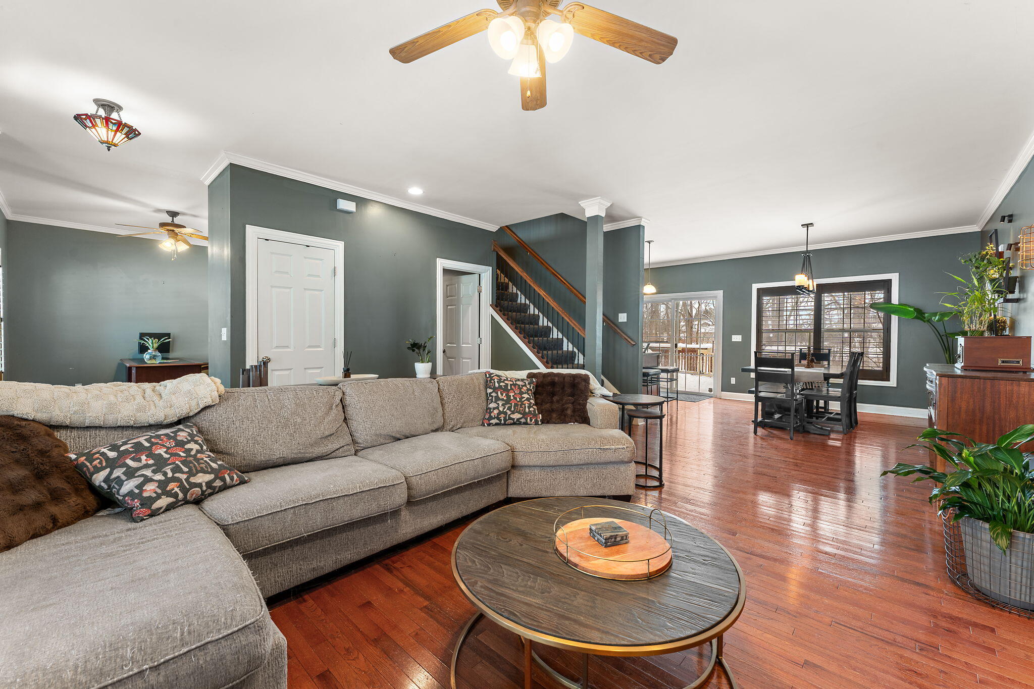 3302 Kestrel Street Valparaiso, IN 46383 - Photo 5 of 37 a living room with furniture a wooden floor and a chandelier