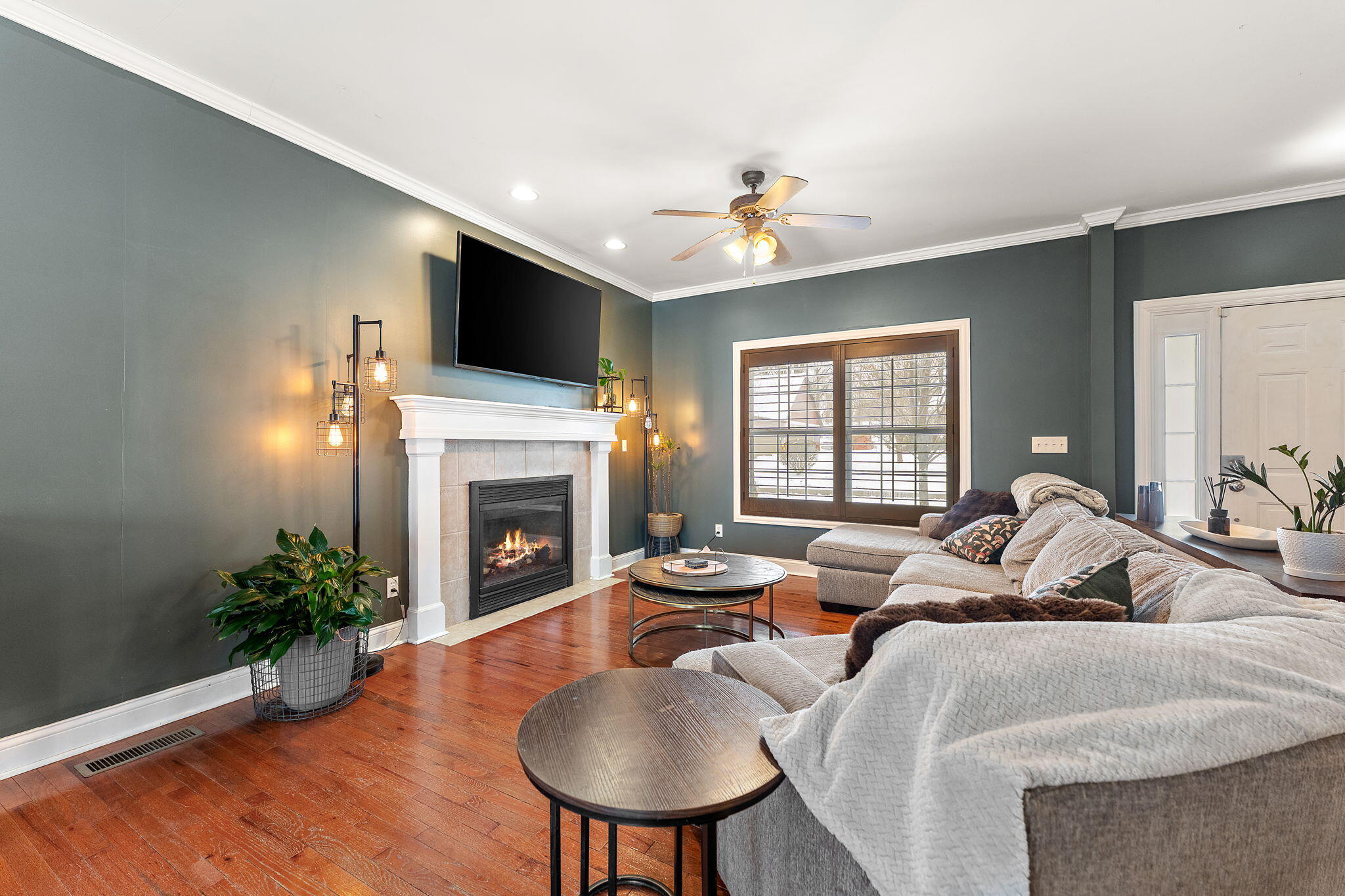 3302 Kestrel Street Valparaiso, IN 46383 - Photo 7 of 37 a living room with furniture a fireplace and a flat screen tv